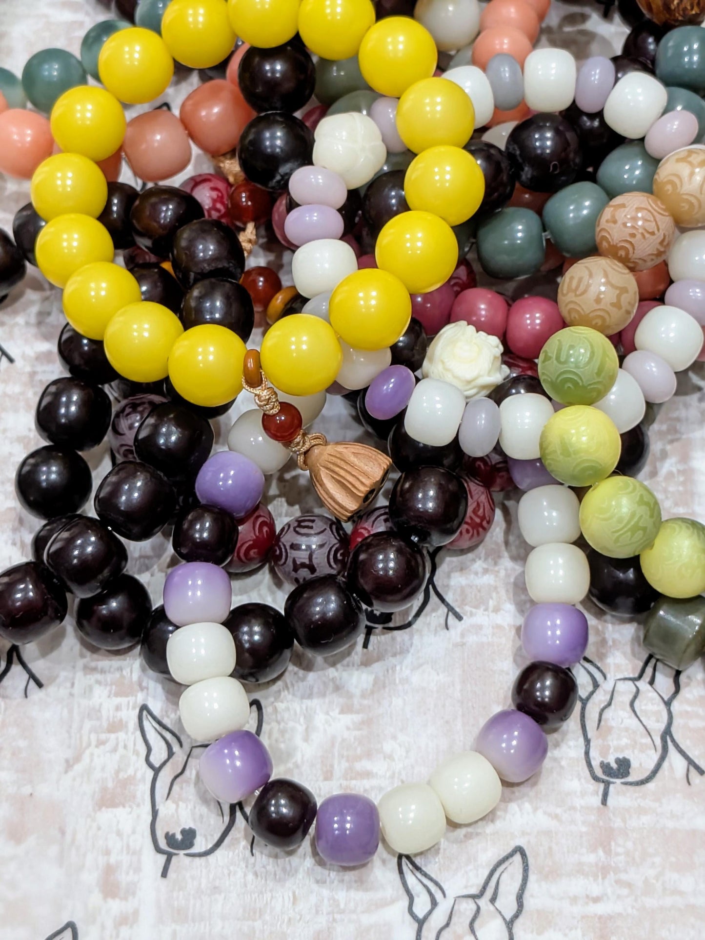 Handmade Bodhi Bead Bracelet — White, Black & Purple Barrel with White Lion Spacer
